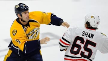 Nashville Predators defenseman Barret Jackman (5) and Chicago Blackhawks center Andrew Shaw (65) exchange hits during a fight. Mandatory Credit: Christopher Hanewinckel-USA TODAY Sports