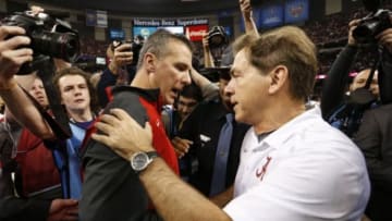 Jan 1, 2015; New Orleans, LA, USA; Ohio State Buckeyes head coach Urban Meyer and Alabama Crimson Tide head coach Nick Saban greet each other after the 2015 Sugar Bowl at Mercedes-Benz Superdome. Ohio State defeated Alabama 42-35. Mandatory Credit: Matthew Emmons-USA TODAY Sports