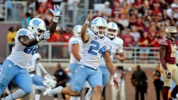 Oct 1, 2016; Tallahassee, FL, USA; North Carolina Tarheels kicker Nick Weiler (24) celebrates after kicking the game winning field goal against the Florida State Seminoles at Doak Campbell Stadium. Mandatory Credit: Melina Vastola-USA TODAY Sports