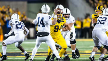Iowa defensive end A.J. Epenesa (94) hurries Penn State quarterback Sean Clifford (14) during a NCAA Big Ten Conference football game between the Iowa Hawkeyes and Penn State, Saturday, Oct., 12, 2019, at Kinnick Stadium in Iowa City, Iowa.191012 Penn St Iowa Fb 014 Jpg