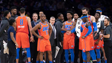 Danilo Gallinari #8, Chris Paul #3, head coach Billy Donovan, Shai Gilgeous-Alexander #2, Dennis Schroder #17, and Steven Adams #12 of the OKC Thunder look on against the Philadelphia 76ers (Photo by Mitchell Leff/Getty Images)