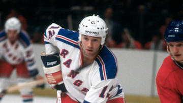 NEW YORK - CIRCA 1979: Don Maloney #12 of the New York Rangers skates against the Montreal Canadiens during an NHL Hockey game circa 1979 at Madison Square Garden in the Manhattan borough of New York City. Maloney's playing career went from 1978-91. (Photo by Focus on Sport/Getty Images)