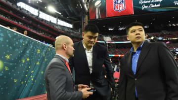 Former NBA player Yao Ming (C) arrives for Super Bowl LI between the New England Patriots and the Atlanta Falcons at NGR Stadium in Houston, Texas, on February 5, 2017. / AFP / Timothy A. CLARY (Photo credit should read TIMOTHY A. CLARY/AFP/Getty Images)