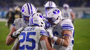 BOCA RATON, FLORIDA - DECEMBER 22: Tyler Allgeier #25 of the Brigham Young Cougars celebrates a touchdown with teammates in the second half against the Central Florida Knights at FAU Stadium on December 22, 2020 in Boca Raton, Florida. (Photo by Mark Brown/Getty Images)