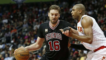 Feb 26, 2016; Atlanta, GA, USA; Chicago Bulls center Pau Gasol (16) dribbles the ball around Atlanta Hawks center Al Horford (15) in the third quarter at Philips Arena. The Hawks won 103-88. Mandatory Credit: Jason Getz-USA TODAY Sports