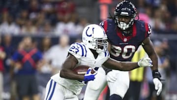 Oct 16, 2016; Houston, TX, USA; Indianapolis Colts running back Frank Gore (23) runs with the ball during the third quarter as Houston Texans defensive end Jadeveon Clowney (90) defends at NRG Stadium. Mandatory Credit: Troy Taormina-USA TODAY Sports