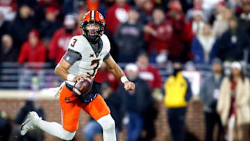 Oklahoma State's Spencer Sanders (3) runs in the first half during the Bedlam college football game between the University of Oklahoma Sooners (OU) and the Oklahoma State University Cowboys (OSU) at Gaylord Family-Oklahoma Memorial Stadium, in Norman, Okla., Saturday, Nov., 19, 2022.Presto Id