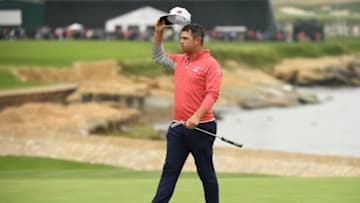 PEBBLE BEACH, CALIFORNIA - JUNE 16: Gary Woodland of the United States acknowledges the crowd on the 18th green after winning the 2019 U.S. Open at Pebble Beach Golf Links on June 16, 2019 in Pebble Beach, California. (Photo by Ross Kinnaird/Getty Images)