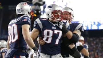 Jan 10, 2015; Foxborough, MA, USA; New England Patriots tight end Rob Gronkowski (87) celebrates with teammates after scoring a touchdown in the third quarter against the Baltimore Ravens during the 2014 AFC Divisional playoff football game at Gillette Stadium. Mandatory Credit: Greg M. Cooper-USA TODAY Sports