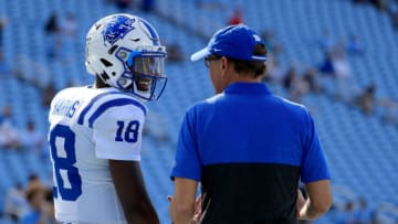 Duke football head coach David Cutcliffe taking with quarterback Quentin Harris. (Photo by Streeter Lecka/Getty Images)