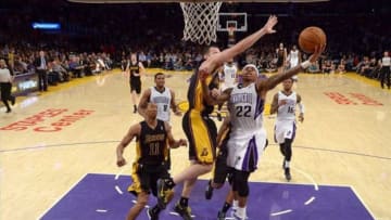 Feb 28, 2014; Los Angeles, CA, USA; Sacramento Kings guard Isaiah Thomas (22) is defended by Los Angeles Lakers guard Jordan Farmar (1) at Staples Center. The Lakers defeated the Kings 126-122. Mandatory Credit: Kirby Lee-USA TODAY Sports