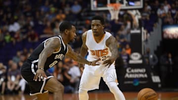 Nov 12, 2016; Phoenix, AZ, USA; Phoenix Suns guard Eric Bledsoe (2) passes the ball by Brooklyn Nets guard Sean Kilpatrick (6) during the first half at Talking Stick Resort Arena. Mandatory Credit: Joe Camporeale-USA TODAY Sports