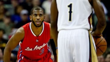 Jan 30, 2015; New Orleans, LA, USA; Los Angeles Clippers guard Chris Paul (3) defends New Orleans Pelicans guard Tyreke Evans (1) during the first quarter of a game at the Smoothie King Center. Mandatory Credit: Derick E. Hingle-USA TODAY Sports
