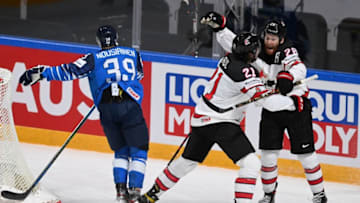 Canada's forward Nick Paul (C) celebrates scoring the winning 3-2 goal with team mate Canada's forward Connor Brown (R) during the IIHF Men's Ice Hockey World Championships final match between the Finland and Canada at the Arena Riga in Riga, Latvia, on June 5, 2021. - A 3-2 victory over Finland crowned Canada Ice Hockey World Champions 2021. (Photo by Gints IVUSKANS / AFP) (Photo by GINTS IVUSKANS/AFP via Getty Images)