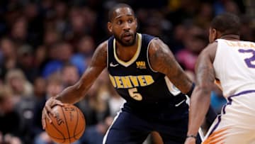 DENVER, CO - JANUARY 19: Will Barton #5 of the Denver Nuggets brings the ball down the court against Isaiah Canaan #2 of the Phoenix Suns at the Pepsi Center on January 19, 2018 in Denver, Colorado. NOTE TO USER: User expressly acknowledges and agrees that, by downloading and or using this photograph, User is consenting to the terms and conditions of the Getty Images License Agreement. (Photo by Matthew Stockman/Getty Images)