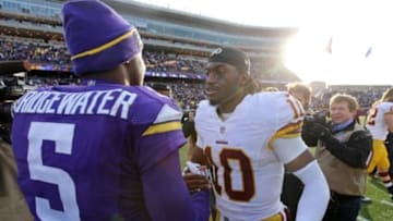 Nov 2, 2014; Minneapolis, MN, USA; Washington Redskins quarterback Robert Griffin (10) talks with Minnesota Vikings quarterback Teddy Bridgewater (5) following the game at TCF Bank Stadium. The Vikings defeated the Redskins 29-26. Mandatory Credit: Brace Hemmelgarn-USA TODAY Sports
