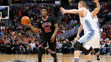 Feb 5, 2016; Denver, CO, USA; Chicago Bulls guard Jimmy Butler (21) passes the ball away from Denver Nuggets center Nikola Jokic (15) in the first quarter at the Pepsi Center. Mandatory Credit: Isaiah J. Downing-USA TODAY Sports
