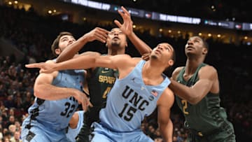 PORTLAND, OR - NOVEMBER 26: North Carolina Tar Heels forward Luke Maye #32, Michigan State Spartans forward Nick Ward #44, North Carolina Tar Heels forward Garrison Brooks #15 and Michigan State Spartans forward Jaren Jackson Jr. #2 battle for position in the first half of the game during the PK80-Phil Knight Invitational presented by State Farm at the Moda Center on November 26, 2017 in Portland, Oregon. (Photo by Steve Dykes/Getty Images)