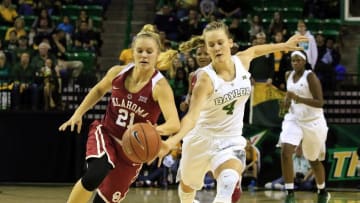Jan 3, 2016; Waco, TX, USA; Baylor Bears guard Kristy Wallace (4) makes hte steal on Oklahoma Sooners guard Gabbi Ortiz (21) during the first half at Ferrell Center. Mandatory Credit: Ray Carlin-USA TODAY Sports