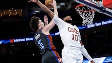 Jan 27, 2023; Oklahoma City, Oklahoma, USA; Oklahoma City Thunder guard Josh Giddey (3) goes to the basket behind Cleveland Cavaliers guard Darius Garland (10) during the second half at Paycom Center. Mandatory Credit: Alonzo Adams-USA TODAY Sports