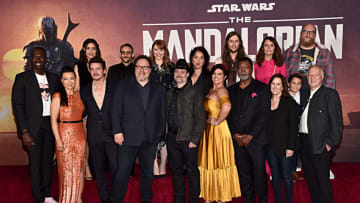 HOLLYWOOD, CALIFORNIA - NOVEMBER 13: (Back L-R) Rick Famuyiwa, Julia Jones, Omid Abtahi, Director Bryce Dallas Howard, Director Deborah Chow, Composer Ludwig Göransson, Emily Swallow, Brian Posehn, (Front L-R) Ming-Na Wen, Pedro Pascal, Executive Producer Jon Favreau, Executive Producer/Director Dave Filoni, Gina Carano, Carl Weathers, Executive Producer Kathleen Kennedy, Aidan Bertolav and Werner Herzog arrive at the premiere of Lucasfilm's first-ever, live-action series, "The Mandalorian," at the El Capitan Theatre in Hollywood, Calif. on November 13, 2019. "The Mandalorian" streams exclusively on Disney+. (Photo by Alberto E. Rodriguez/Getty Images for Disney)