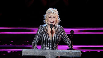 Dolly Parton speaks at the 37th annual Rock & Roll Hall of Fame Induction Ceremony.