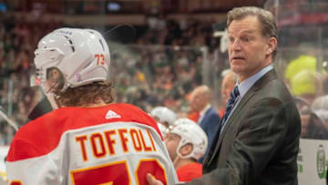 Mar 1, 2022; Saint Paul, Minnesota, USA; Calgary Flames right wing Tyler Toffoli (73) is congratulated by assistant coach Kirk Muller after scoring against the Minnesota Wild in the third period at Xcel Energy Center. Mandatory Credit: Matt Blewett-USA TODAY Sports