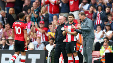 SOUTHAMPTON, ENGLAND - AUGUST 31: Ralph Hasenhuttl, Manager of Southampton speaks with Shane Long of Southampton before he is substituted on during the Premier League match between Southampton FC and Manchester United at St Mary's Stadium on August 31, 2019 in Southampton, United Kingdom. (Photo by Steve Bardens/Getty Images)