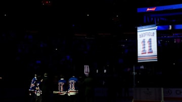 The banner for New York Rangers Vic Hadfield is raised. Mandatory Credit: Dennis Schneidler-USA TODAY Sports