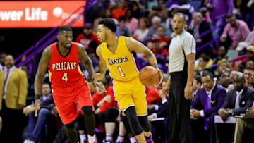 Apr 8, 2016; New Orleans, LA, USA; Los Angeles Lakers guard D'Angelo Russell (1) is guarded by New Orleans Pelicans forward James Ennis (4) during the second half of a game at the Smoothie King Center. The Pelicans defeated the Lakers 110-102. Mandatory Credit: Derick E. Hingle-USA TODAY Sports
