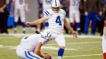 Nov 22, 2015; Atlanta, GA, USA; Indianapolis Colts place kicker Adam Vinatieri (4) kicks the game winning field goal from the hold of punter Pat McAfee (1) against the Atlanta Falcons during the fourth quarter at the Georgia Dome. The Colts defeated the Falcons 24-21. Mandatory Credit: Dale Zanine-USA TODAY Sports