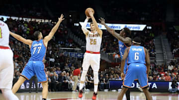 Dec 5, 2016; Atlanta, GA, USA; Atlanta Hawks guard Kyle Korver (26) attempts a three point basket against Oklahoma City Thunder center Joffrey Lauvergne (77) and guard Anthony Morrow (2) in the third quarter of their game at Philips Arena. The Thunder won 102-99. Mandatory Credit: Jason Getz-USA TODAY Sports