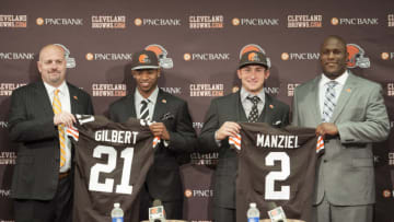 BEREA, OH - MAY 9: Cleveland Browns draft picks Justin Gilbert #21 and Johnny Manziel #2 are introduced by general manager Ray Farmer (L) and head coach Mike Pettine (R) during a press conference at the Browns training facility on May 9, 2014 in Cleveland, Ohio. Gilbert and Manziel were selected 8th and 22nd, respectively, in the first round. (Photo by Jason Miller/Getty Images)