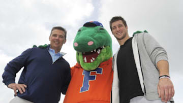 LAKE BUENA VISTA, FL - MARCH 05: (L-R) In this handout photo provided by Disney Parks, ESPN college football analyst and former University of Florida football coach, Urban Meyer, "Albert" The University of Florida mascot and Denver Broncos Quarterback and former University of Florida Quarterback, Tim Tebow attend "ESPN The Weekend" on March 05, 2011 at Disney's Hollywood Studios Park at Walt Disney World Resort in Lake Buena Vista, Florida. (Photo by Mark Ashman/Disney Parks via Getty Images)