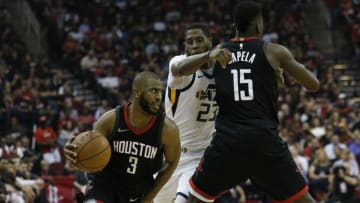 HOUSTON, TX - MAY 08: Chris Paul #3 of the Houston Rockets drives past Royce O'Neale #23 of the Utah Jazz as he receives a pick from Clint Capela #15 during Game Five of the Western Conference Semifinals of the 2018 NBA Playoffs at Toyota Center on May 8, 2018 in Houston, Texas. NOTE TO USER: User expressly acknowledges and agrees that, by downloading and or using this photograph, User is consenting to the terms and conditions of the Getty Images License Agreement. (Photo by Bob Levey/Getty Images)