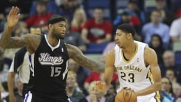 Mar 31, 2014; New Orleans, LA, USA; New Orleans Pelicans forward Anthony Davis (23) is defended by Sacramento Kings center DeMarcus Cousins (15) in the first quarter at the Smoothie King Center. Mandatory Credit: Crystal LoGiudice-USA TODAY Sports