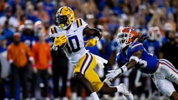 LSU Tigers wide receiver Jaray Jenkins (10) runs with the ball while Florida Gators cornerback Jaydon Hill (23) chases during the first half at Steve Spurrier Field at Ben Hill Griffin Stadium in Gainesville, FL on Saturday, October 15, 2022. [Matt Pendleton/Gainesville Sun]Ncaa Football Florida Gators Vs Lsu Tigers
