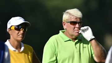 Jul 29, 2016; Springfield, NJ, USA; John Daly smokes a cigarette on the sixth hole during the second round of the 2016 PGA Championship golf tournament at Baltusrol GC - Lower Course. Mandatory Credit: Eric Sucar-USA TODAY Sports