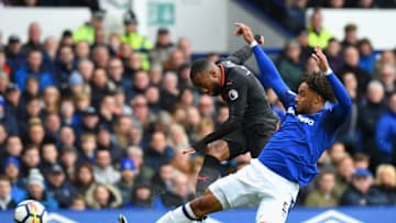 LIVERPOOL, ENGLAND - OCTOBER 22: Alexandre Lacazette of Arsenal shoots as Ashley Williams of Everton attempts to block during the Premier League match between Everton and Arsenal at Goodison Park on October 22, 2017 in Liverpool, England. (Photo by Tony Marshall/Getty Images)