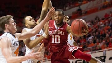 Jan 13, 2016; Stillwater, OK, USA; Oklahoma Sooners guard Jordan Woodard (10) goes to the basket as Oklahoma State Cowboys forward Mitchell Solomon (41) defends during the first half at Gallagher-Iba Arena. Mandatory Credit: Rob Ferguson-USA TODAY Sports