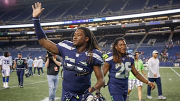 SEATTLE, WA - AUGUST 09: Linebacker Shaquem Griffin #49 (L) and brother Shaquill Griffin #26 of the Seattle Seahawks head off the field after the game against the Indianapolis Colts at CenturyLink Field on August 9, 2018 in Seattle, Washington. (Photo by Otto Greule Jr/Getty Images)