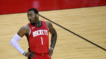 HOUSTON, TEXAS - FEBRUARY 22: John Wall #1 of the Houston Rockets looks on during the first quarter of a game against the Chicago Bulls at the Toyota Center on February 22, 2021 in Houston, Texas. NOTE TO USER: User expressly acknowledges and agrees that, by downloading and or using this photograph, User is consenting to the terms and conditions of the Getty Images License Agreement. (Photo by Carmen Mandato/Getty Images)