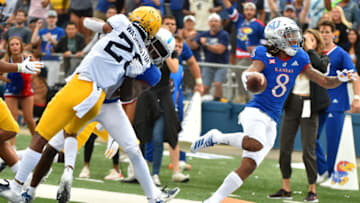 Wide receiver Kwamie Lassiter II #8 of Kansas football goes into the end zone for a 28-yard touchdown. (Photo by Ed Zurga/Getty Images)
