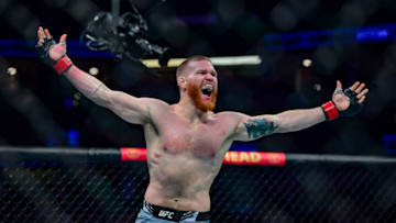 Jan 22, 2022; Anaheim, California, USA; Matt Frevola (red gloves) celebrates his win by TKO over against Genaro Valdez (blue gloves) during UFC 270 at Honda Center. Mandatory Credit: Gary A. Vasquez-USA TODAY Sports