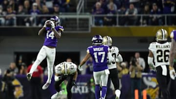 MINNEAPOLIS, MN - JANUARY 14: Stefon Diggs #14 of the Minnesota Vikings leaps to catch the ball in the fourth quarter of the NFC Divisional Playoff game against the New Orleans Saints on January 14, 2018 at U.S. Bank Stadium in Minneapolis, Minnesota. Diggs scored a 61-yard touchdown to win the game 29-24. (Photo by Hannah Foslien/Getty Images)
