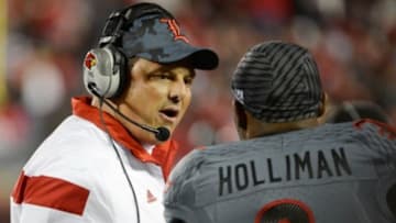 Oct 30, 2014; Louisville, KY, USA; Louisville Cardinals defensive coordinator Todd Grantham talks with safety Gerod Holliman (8) during the second half against the Florida State Seminoles at Papa John