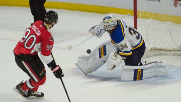Mar 1, 2016; Ottawa, Ontario, CAN; St. Louis Blues goalie Jake Allen (34) makes a save on a shot from Ottawa Senators right wing Alex Chiasson (90) in the shootout at the Canadian Tire Centre. The Blues defeated the Senators 4-3. Mandatory Credit: Marc DesRosiers-USA TODAY Sports