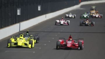 May 27, 2016; Indianapolis, IN, USA; Verizon Indy Car drivers Simon Pagenaud (22) and Graham Rahal (15) drive side by side down the front straightaway during Carb Day for the Indianapolis 500 at Indianapolis Motor Speedway. Mandatory Credit: Brian Spurlock-USA TODAY Sports