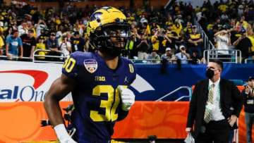 Michigan defensive back Daxton Hill (30) takes the field for warm up before the kickoff of the Orange Bowl against Georgia at the Hard Rock Stadium in Miami, Fla. on Friday, Dec. 31, 2021.
