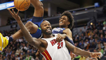 Minnesota Timberwolves forward Jaden McDaniels (3) fouls Miami Heat center Dewayne Dedmon (21)(Bruce Kluckhohn-USA TODAY Sports)